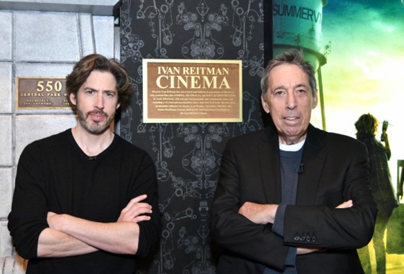 Ivan and Jason Reitman standing in front of a sign.